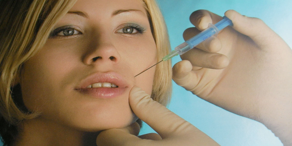 a woman getting a dermal filler injection